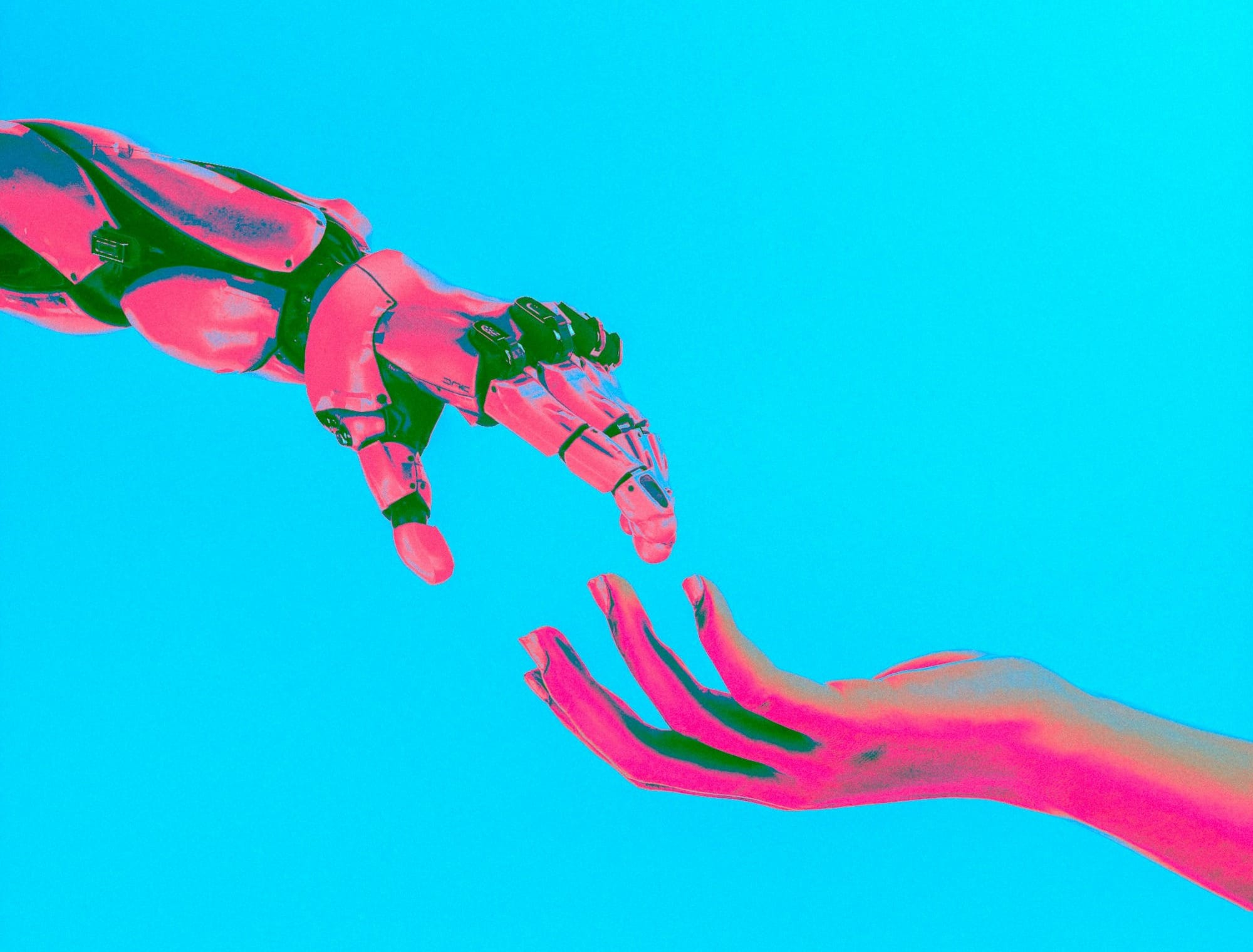 two hands reaching for a flying object in the sky